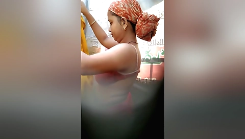 Hot brunette in red bikini is having fun in the bathroom