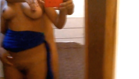 A brunette and a sexy guy in a tight dress in an amateur video