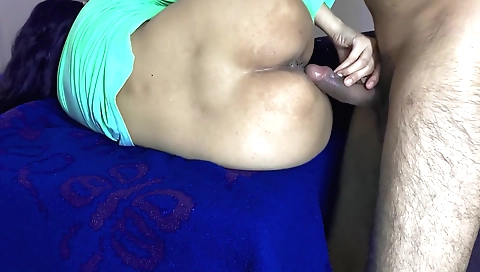 Brunette in a black dress and stockings giving a blowjob