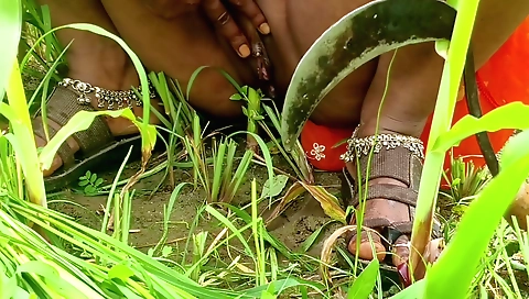 Solo female masturbates with her finger in outdoor scene