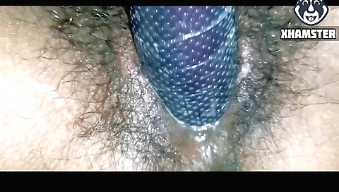 Hairy girl with a lovely body uses a toy in her vagina