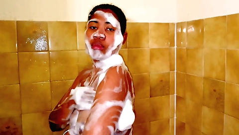 Busty ebony teen with big tits taking a hot shower