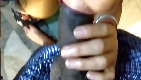 Indian chick with a big and round cock is sucking it