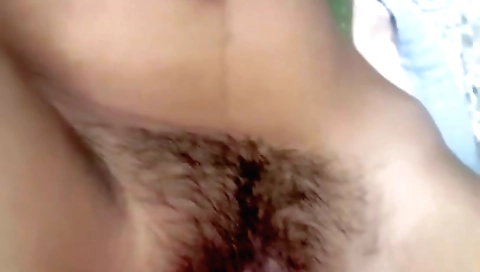 Busty brunette girl in a sexy black dress with a ponytail