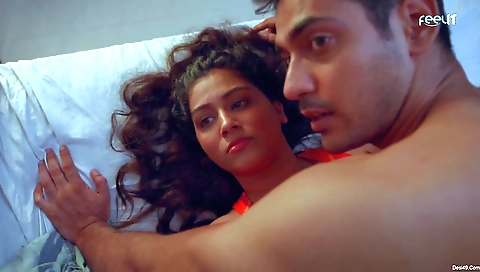 Stunning brunett beauty wears a dress and stockings on