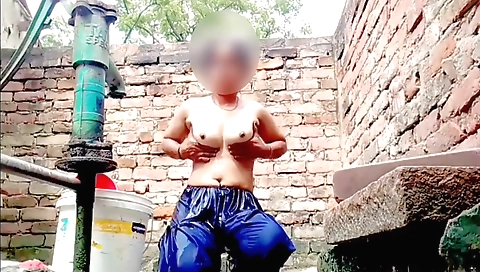 Naked brunette woman with nice body is on the water