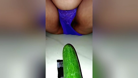 Indian chick masturbates with a cucumber in solo porn video