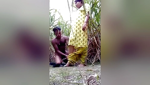 Brunette and a blonde in red t-shirt and a black shirt outdoor