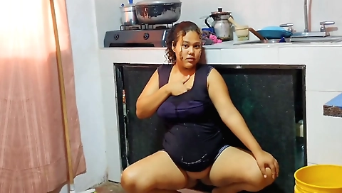 Chubby brunette is cleaning up the kitchen of the stepfather