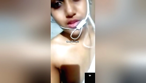 Sexy brunette shows her beautiful boobs in a solo video